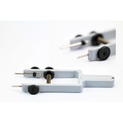 UTENSILE DI PLASTICA PER PIAZZARE LE ANSECON 2 PUNTE REVER.